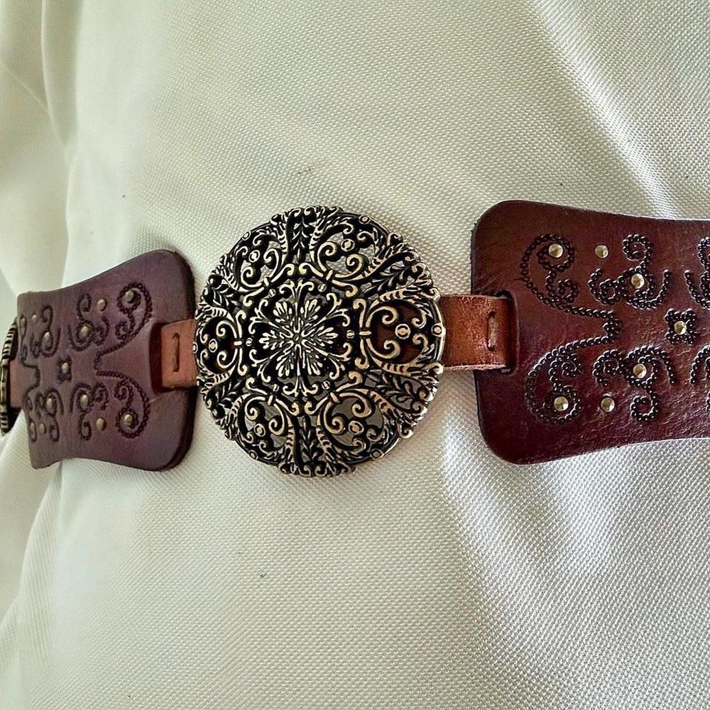 Fossil genuine leather belt with ornate floral and scrollwork design